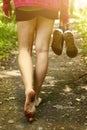 Bare feet walking along forest way close up photo