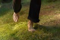 Bare feet of a woman walking carefully on soft moss Royalty Free Stock Photo