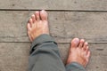 Bare feet on the wooden floor Royalty Free Stock Photo