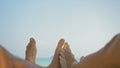 Barefoot young man and woman rest lying on beach near ocean Royalty Free Stock Photo