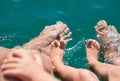 Bare feets in the water of the sea boy, mother, father. Positive human emotions, feelings,