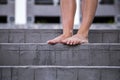 Bare female feet on the stairs