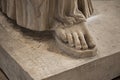 Bare foot of a carved bronze statue in the museum there are many hard feet of ancient and historical style in greek art room Royalty Free Stock Photo