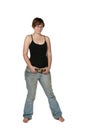 Bare foot young woman in faded jeans