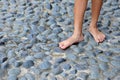 Bare Footed On Cobblestone Royalty Free Stock Photo