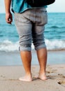 Bare footed man standing on the beach Royalty Free Stock Photo