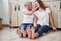 With bare foots. Mother and daughter having good time in the kitchen