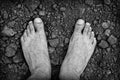 Bare foots over dry soil