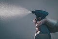 Plastic spray bottle in action Royalty Free Stock Photo