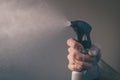 Plastic spray bottle in action Royalty Free Stock Photo