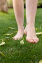 Bare legs and feet with goosebumps walking on the grass to connect with nature Royalty Free Stock Photo