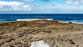 Bare limestone landscape and ocean in Doolin Bay Royalty Free Stock Photo