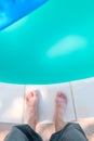 Bare male feet by the poolside