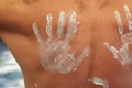Bare man back hand marked sunscreen Royalty Free Stock Photo