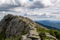 Bare rock and distant mountains on Vermont hill top with dramatic clouds Royalty Free Stock Photo
