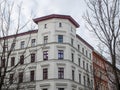 Bare Trees and White Building with Red Trim Royalty Free Stock Photo