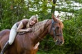 Bareback woman rider hugging her horse Royalty Free Stock Photo