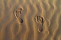 Barefeet footprints on the sand dune Royalty Free Stock Photo