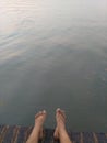 Barefeet in the water relaxing Royalty Free Stock Photo