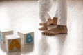 Barefoot african american woman teaching little biracial baby kid walking. Royalty Free Stock Photo