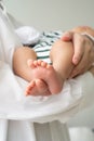 Barefoot of baby sleeping with mother handle gently Royalty Free Stock Photo