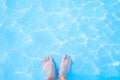 Barefoot and blue swimming pool Royalty Free Stock Photo