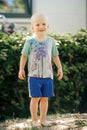 Barefoot boy stands on the sand Royalty Free Stock Photo