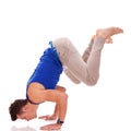 Barefoot casual man doing a handstand