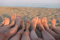 Barefoot of a family on the shore of the sea on the beach with c Royalty Free Stock Photo