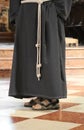 Barefoot friar with sandals Royalty Free Stock Photo