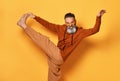 Barefoot funny bearded man in sportswear doing leg stretching Royalty Free Stock Photo