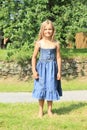 Barefoot girl in blue dress