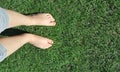 Barefoot girl on grass lawn Royalty Free Stock Photo