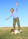 Barefoot girl standing on boy Royalty Free Stock Photo