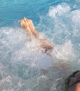 Barefoot girl while taking bath in the thermal pool Royalty Free Stock Photo