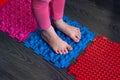 Barefoot girl walks on sensory mats in the sensory integration room