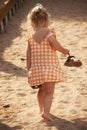 Barefoot little girl walking on beach Royalty Free Stock Photo