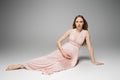 Barefoot and long haired pregnant woman Royalty Free Stock Photo