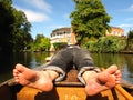 Barefoot man on boat Oxford England punting Royalty Free Stock Photo