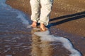 Barefoot man walking on the waves of the surf Royalty Free Stock Photo