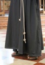 Monk with sandals in the church Royalty Free Stock Photo