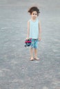 Barefoot Naughty little Girl Staring at the camera at camera Royalty Free Stock Photo