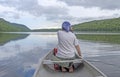 Barefoot Paddler on a Calm Lake Royalty Free Stock Photo