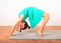 Pretty girl exercising yoga - wheel pose Royalty Free Stock Photo