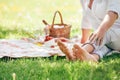 Barefoot sitting on a blanket with food served for romantic picnic