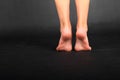 Bare Feet of a teenage girl on tiptoes