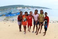 Teenage girls and boy on beach in Manokwari