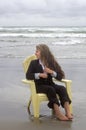 Barefoot Woman in Chair Looking Out To Sea Royalty Free Stock Photo