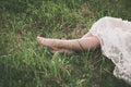 Barefoot woman legs on grass Royalty Free Stock Photo