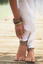 Barefoot woman legs and hand boho summer fashion Royalty Free Stock Photo